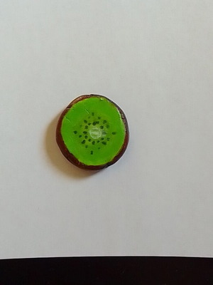 Handmade kiwi fruit magnet from clay