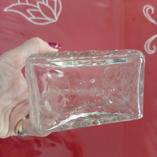 Vintage glass decanter with embossed geometric design and stopper