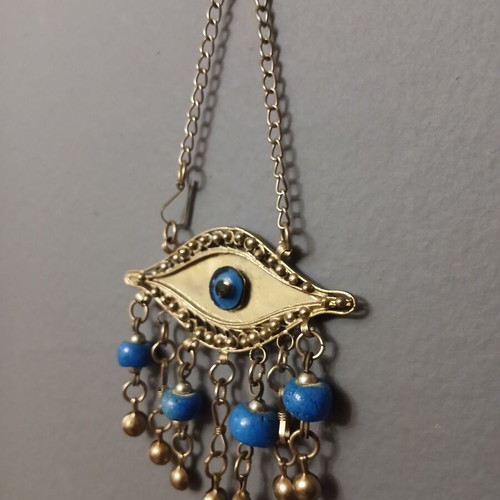Vintage metal evil eye decoration used, silver with blue beads
