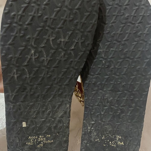 Women's flip flops with floral design, like new, gold bronze