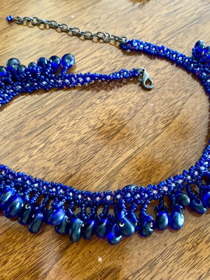Necklace used with blue woven stones in various sizes