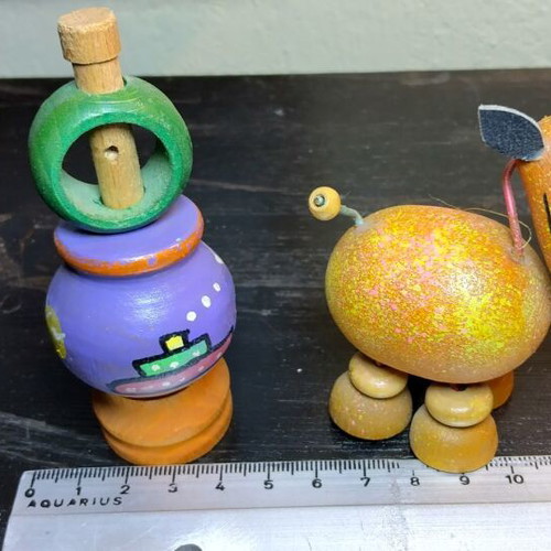 Old wooden toys like new, handmade spinning top and wooden animal