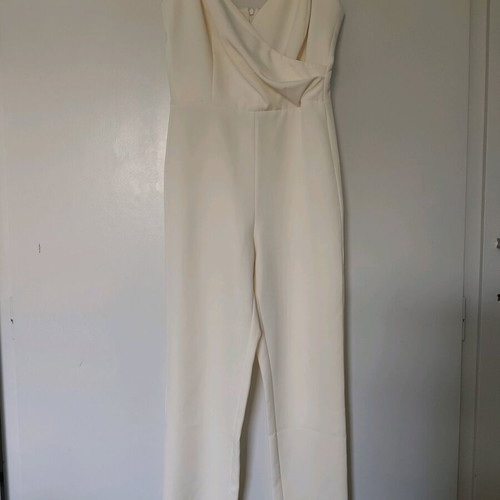 Access jumpsuit extra small white used with minor strap defect