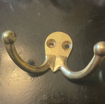 Double and single gold-coloured wall hooks