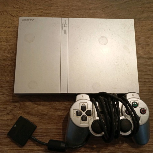 PlayStation 2 console with 3 and 4 games, used