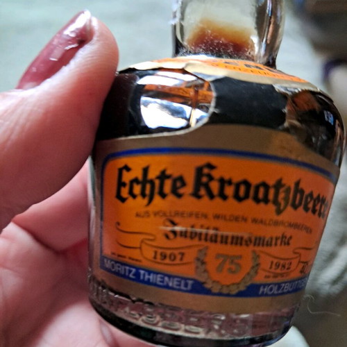 German liqueur with handmade costume like new