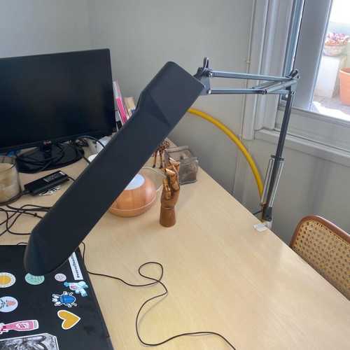 Black screw-on desk lamp used, industrial design