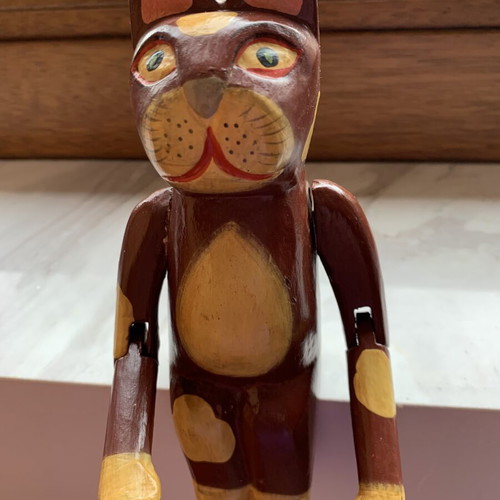 Wooden sitting cat with movable arms, like new, ~20 cm