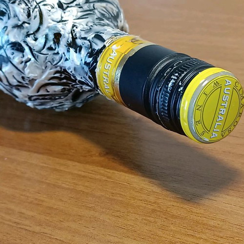 Painted wine bottle used for design