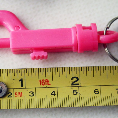 Card with 12 vintage 1980s phosphorescent key chains, new