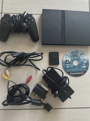 PlayStation 2 Slim console with accessories and The Lord of the Rings game