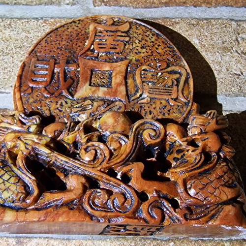 Stone carved sculpture used with dragons and coin