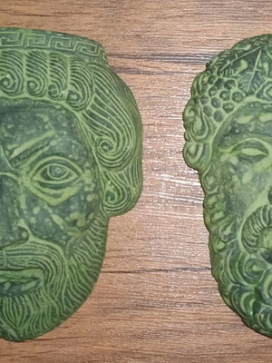 Ceramic hanging masks set of 2 like new