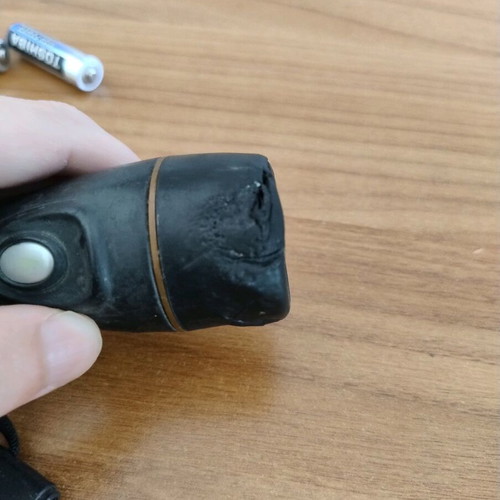 Duracell flashlight used with wear on front part