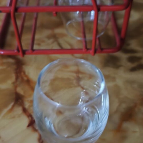Vintage liqueur set with 6 glasses and red metal holder like new