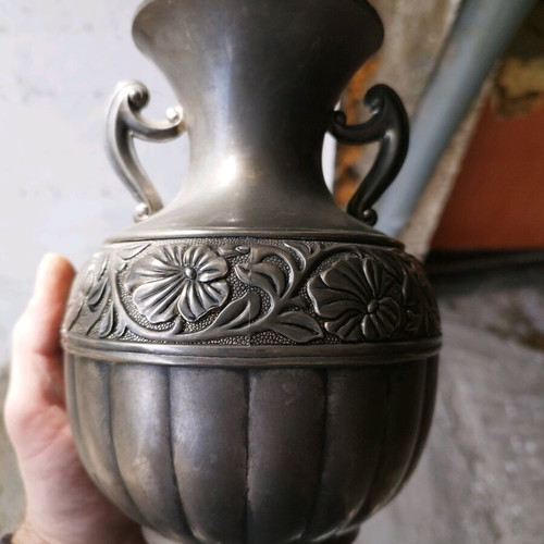 Vintage amphora used with embossed flowers and carved handles