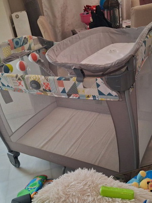 Grey playpen with changing table used