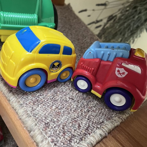 Toy cars, some unused, plastic and metal Mini Cooper