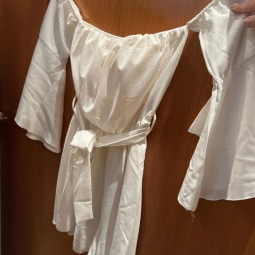 White mini shorts romper with loose sleeves and waist belt