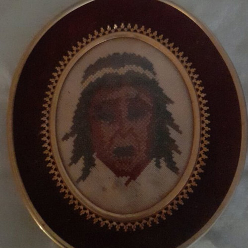 Small oval embroidered Native American head