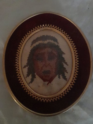 Small oval embroidered Native American head