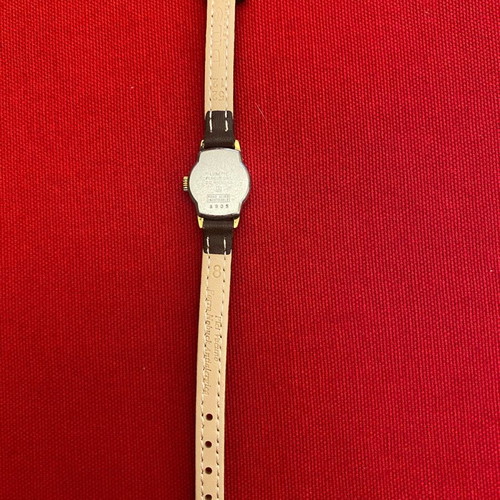Wristwatch women's used, wind-up, metal, gold color, 1960s era