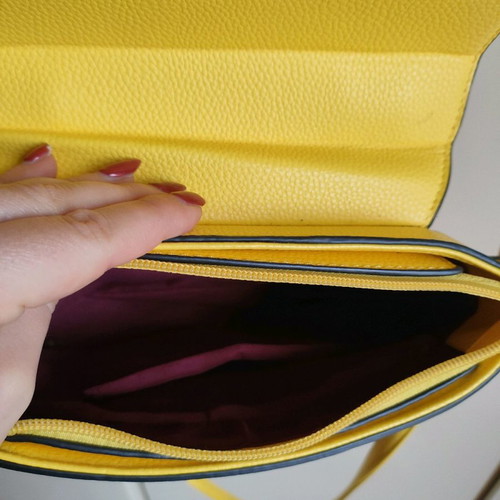 Yellow crossbody bag used with detachable strap