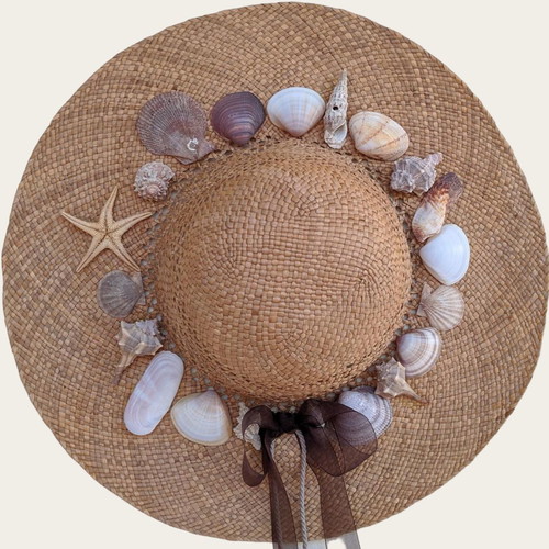 Handmade straw hat with seashells