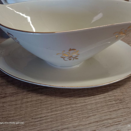 Gravy boat and deep plate used with floral patterns