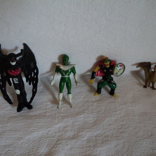 Small action figures used, approx. 8cm, including Power Rangers and Archaeopteryx