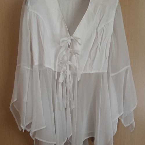 White women's shirt like new, asymmetrical with bows and cords