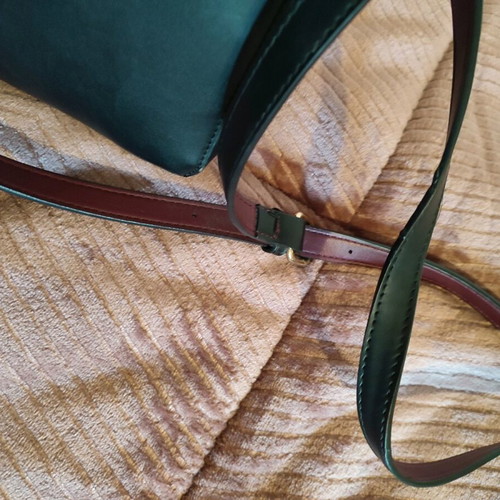 Vintage leather black bag used with flowers and burgundy interior