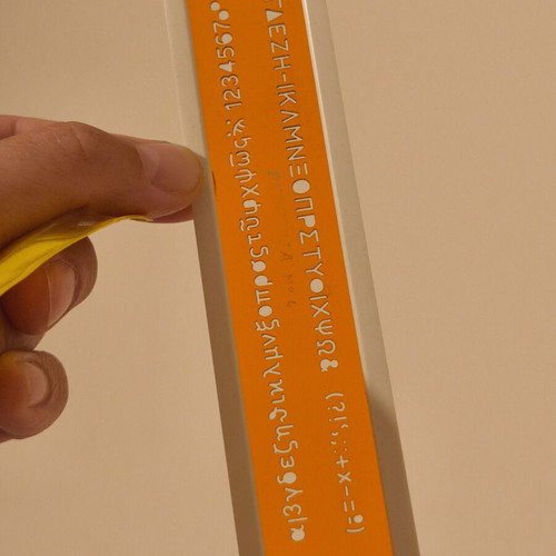 Vintage ruler with letters, symbols and numbers, new in case