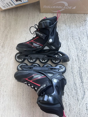 Rollerblades used, size 38.5-40.5, red with protective gear