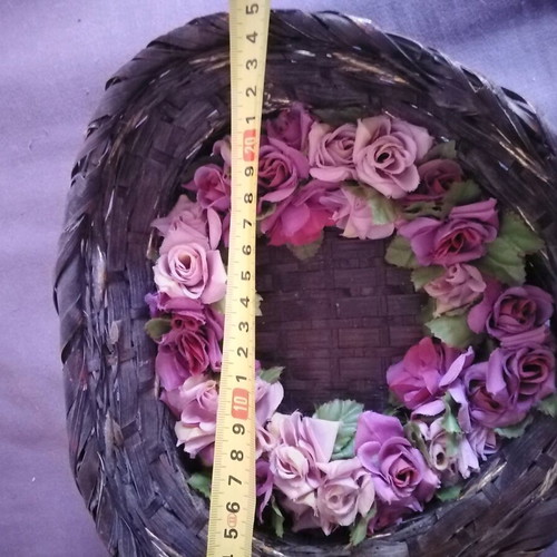 Decorative basket used with candle and floral wreath