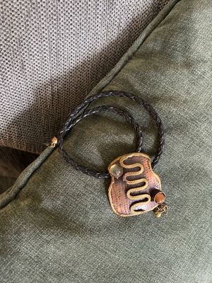 Necklace with metal pendant and leather cord like new, boho style