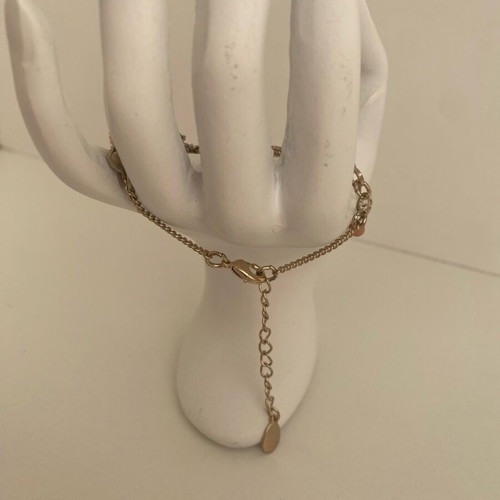 Accessorize bracelet with charms in pink and gold, like new