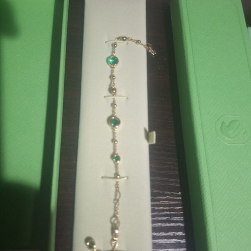 Swarovski bracelet with green stone and gold chain, like new
