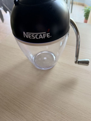 Nescafé manual ice crusher used, one lid ear broken