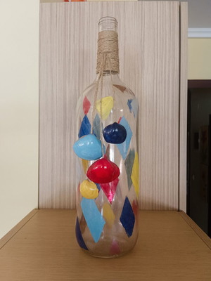 Handmade summer decorative bottle with seashells
