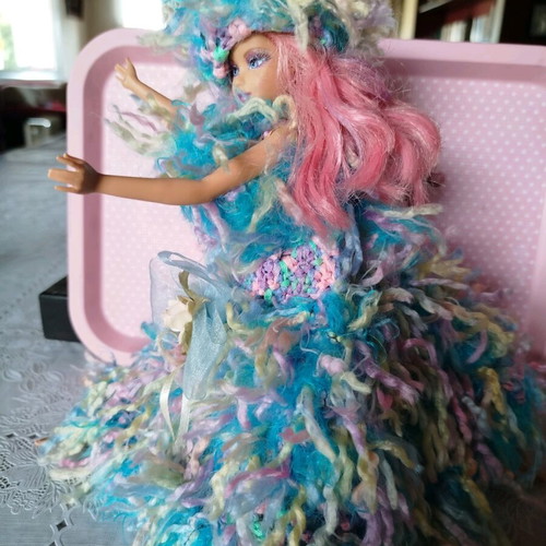 Doll with handmade dress and hat used