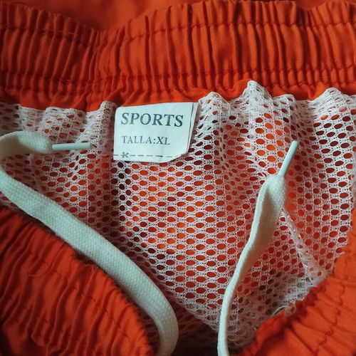 Swim shorts used XL orange with white and turquoise stripe