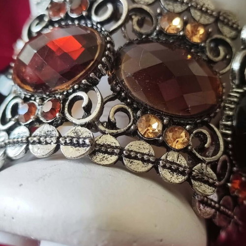 Vintage cuff bracelet with large brown stones and decorative details