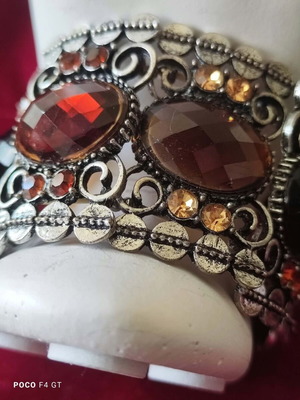 Vintage cuff bracelet with large brown stones and decorative details