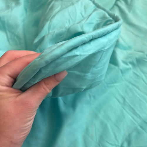 Light blue quilt used for one-and-a-half mattress