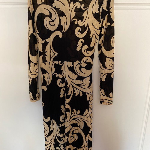 Dress with patterns like new, size large but tight fit, thin fabric