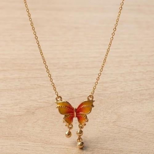 Gold necklace with butterfly, like new, orange accents