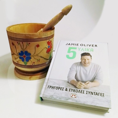 Jamie Oliver 5 Ingredients Cookbook used with wooden mortar and spices