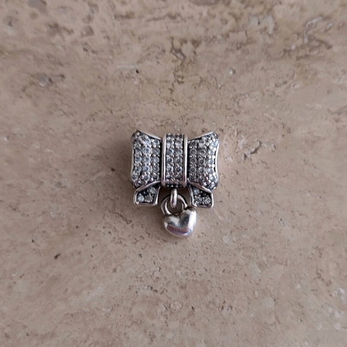 Pandora charm silver 925 like new with bow and heart zirconia