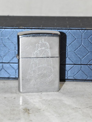 Zippo chrome lighter with sailboat design used